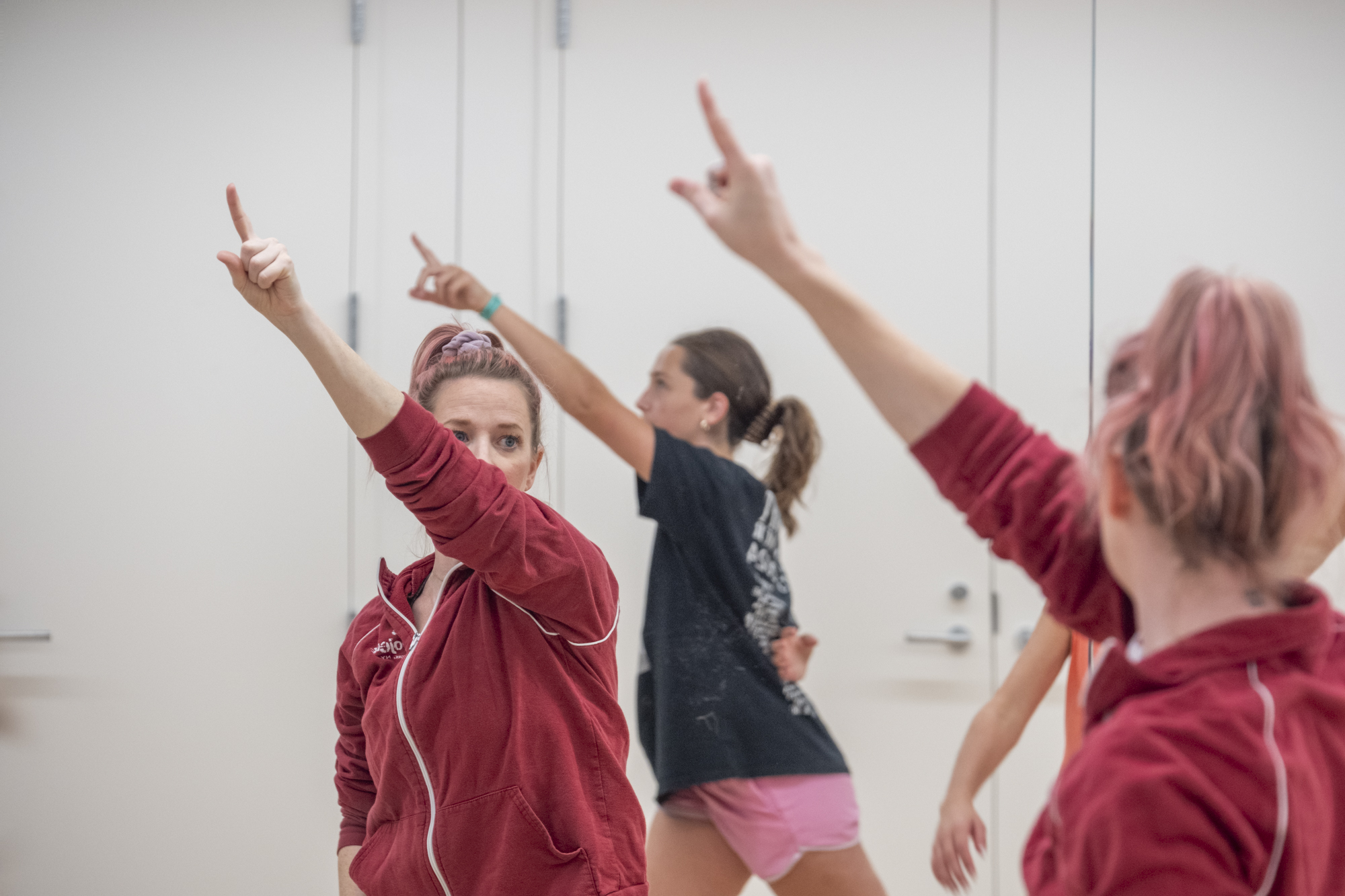 Middle School students learn to use the mirror for informing their dance practice.