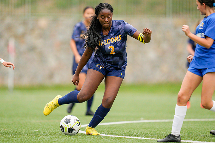 photo of students playing soccer