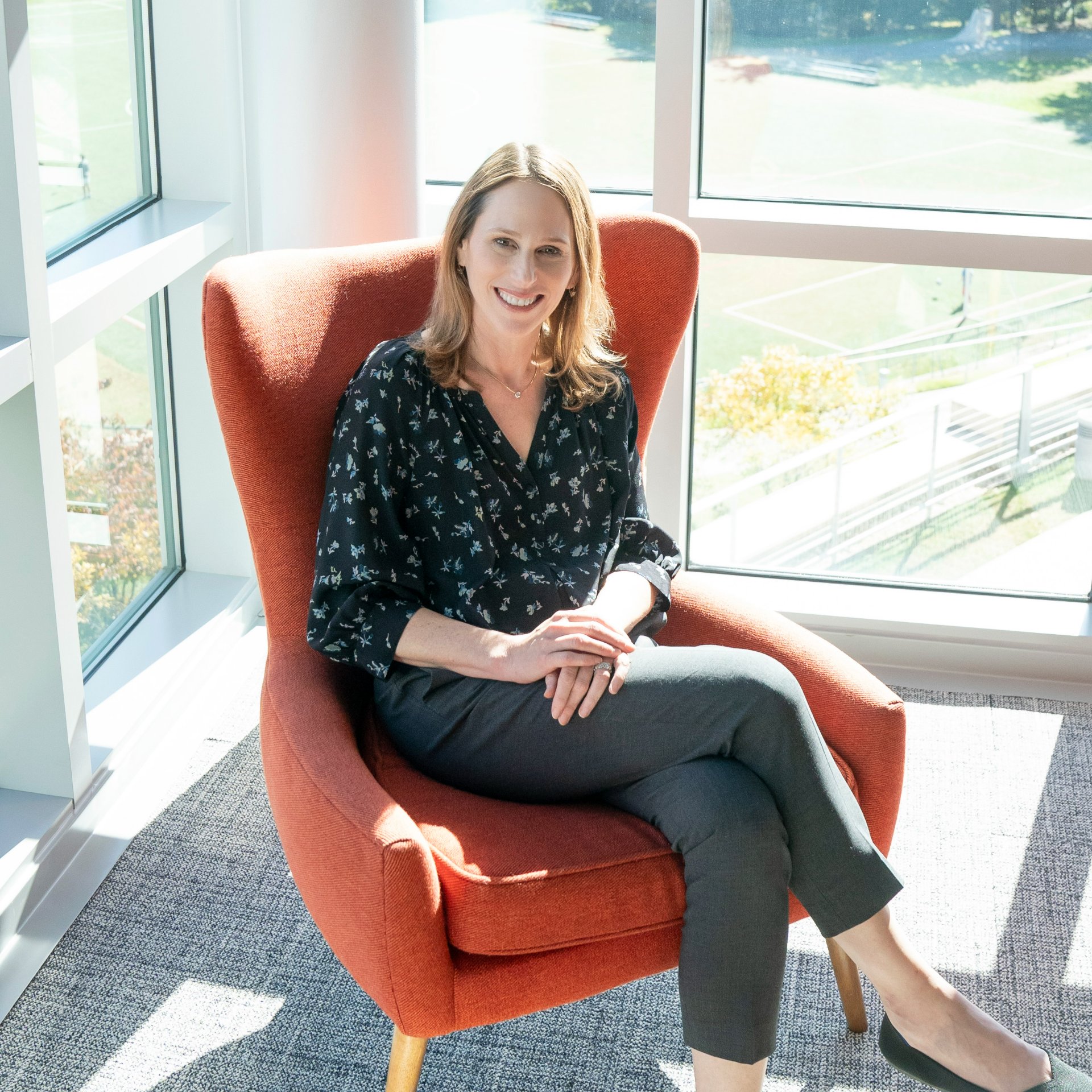 Photo of Lori strauss, head of the field school, sat on chair