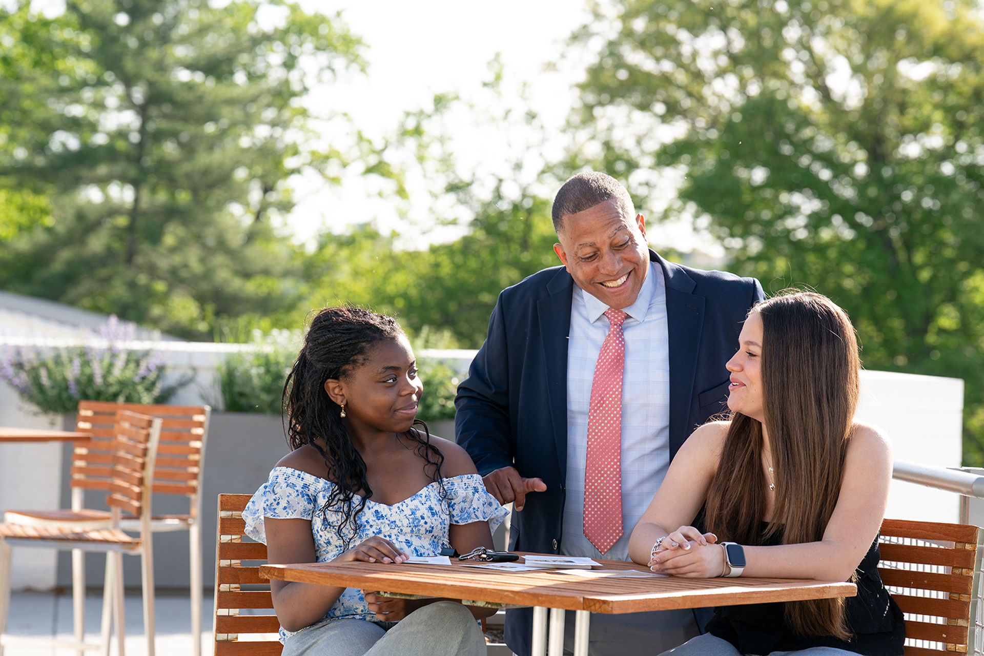 students interacting with teacher
