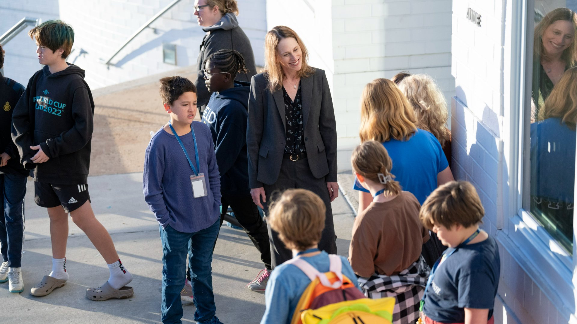 photo of lori strauss, head of the field school, outside with students