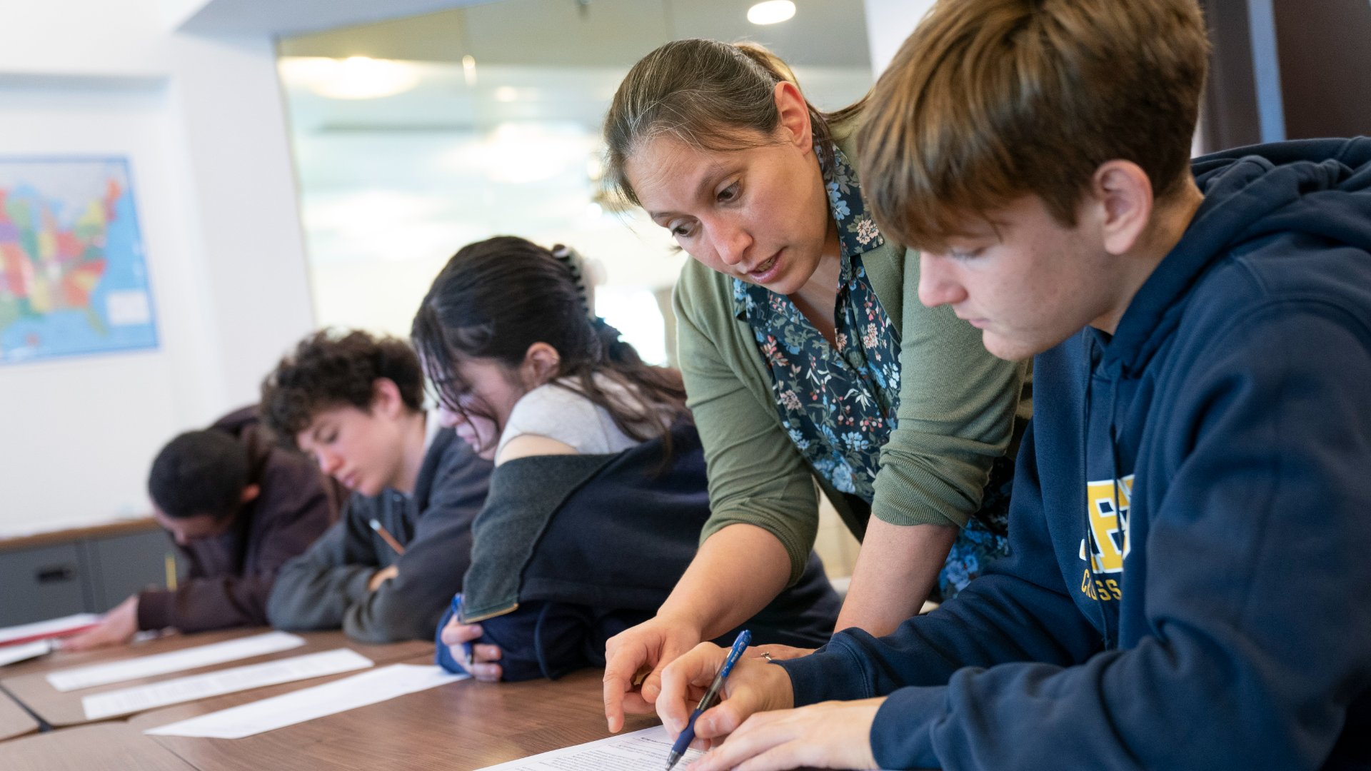 Photo of field school student with a teacher in class