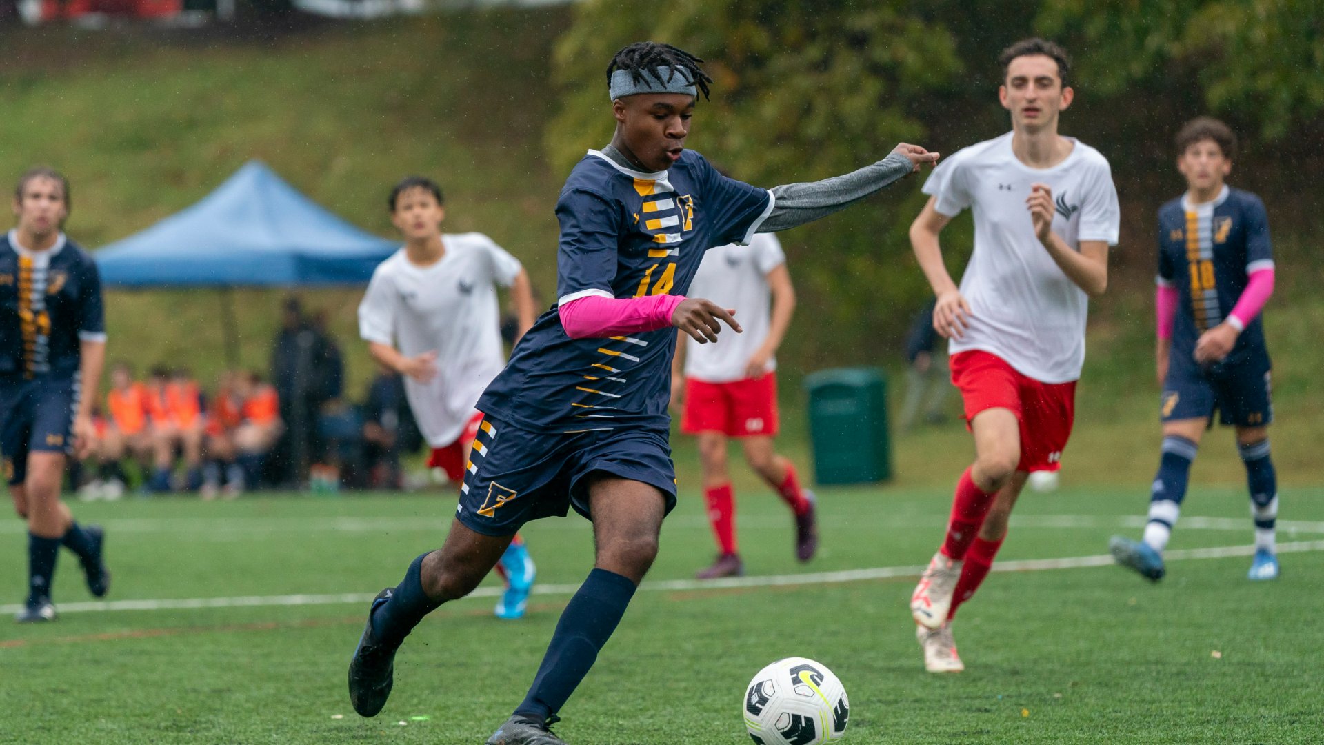 photo of students playing soccer