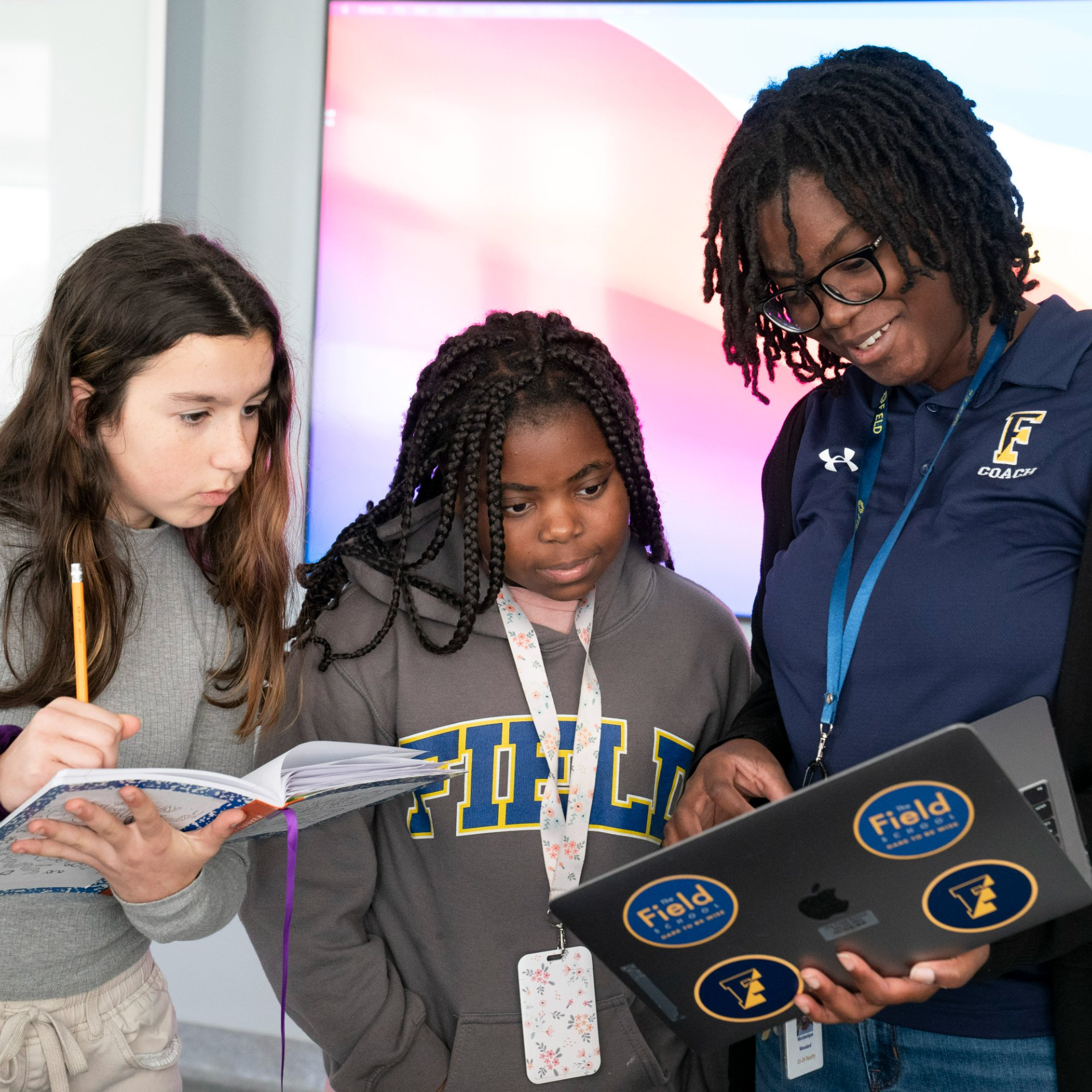 photo of teacher and two students