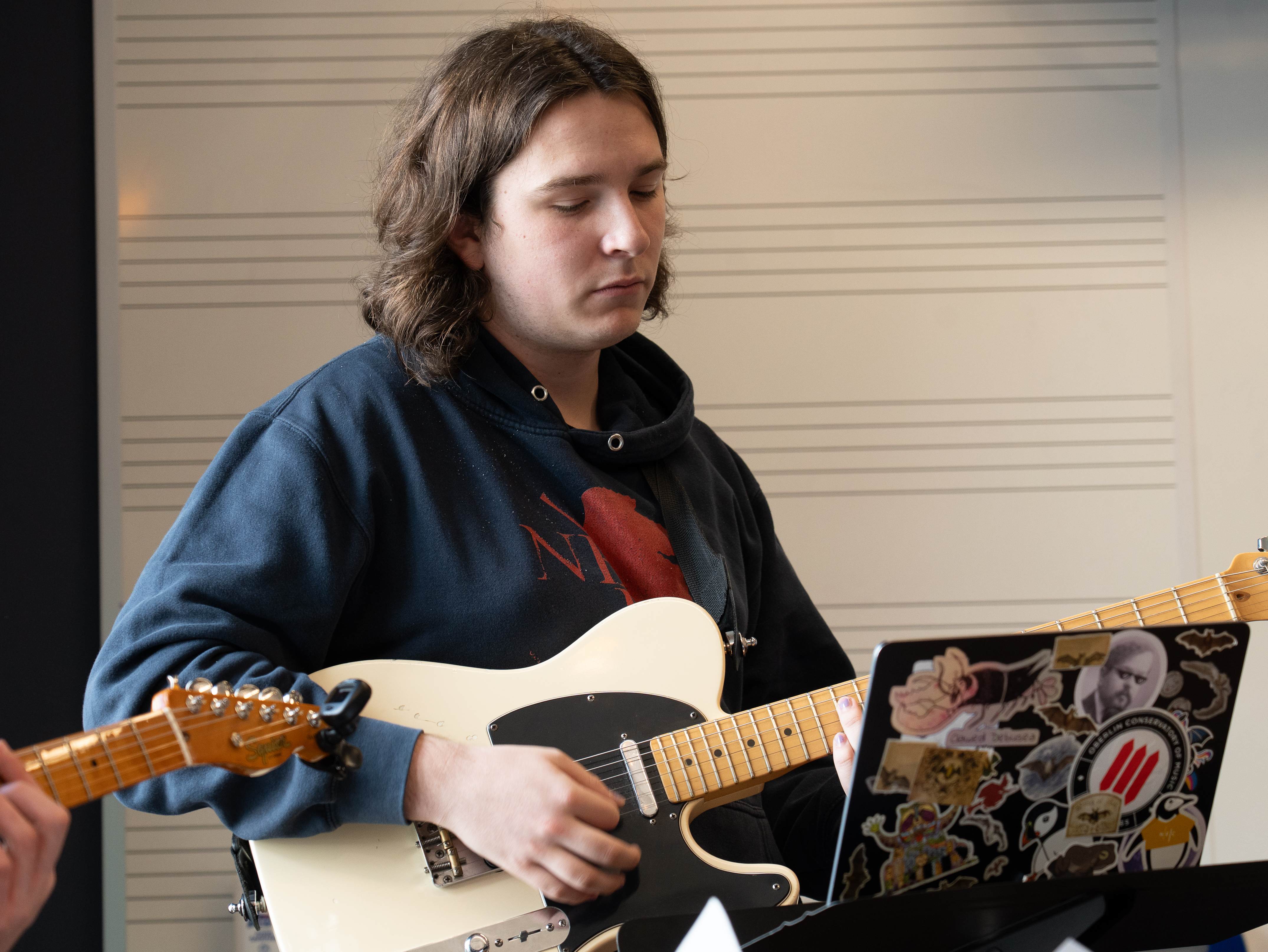 Student playing guitar