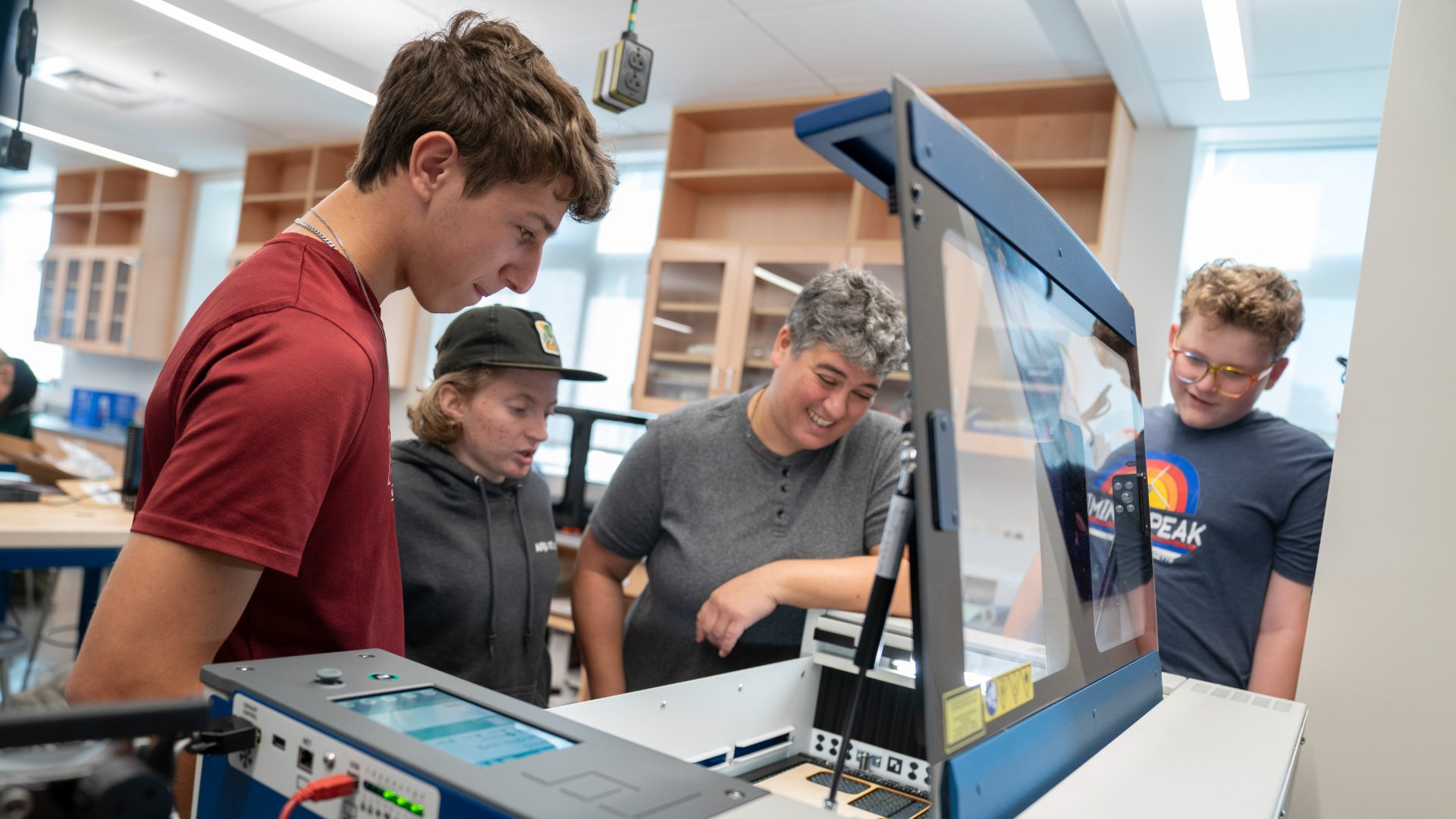 photo of students in tech lab with teacher